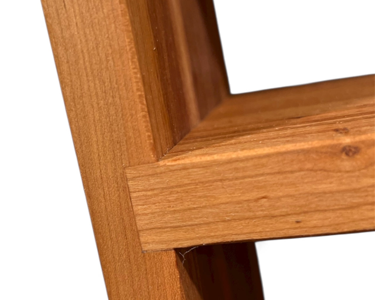 Close-up of a wooden frame corner on a white background