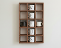 Walnut wooden wall shelf with lettered mugs spelling 'VERUS' on a white wall